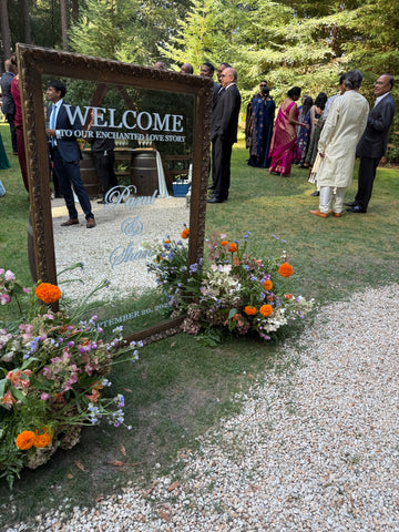 Guests gathering for outdoor wedding with Indian food catering