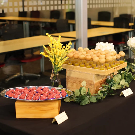Catering buffet setup with assorted Indian dishes